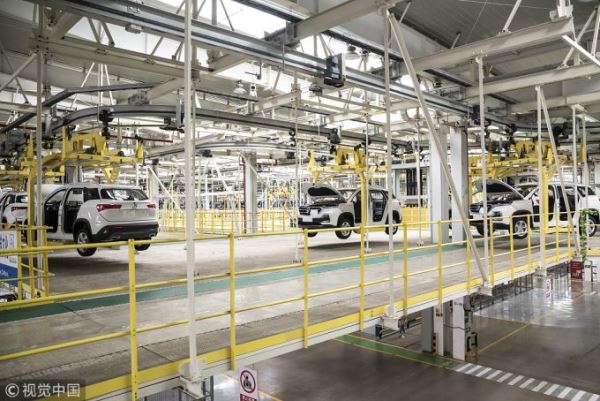 Vehicles move along a conveyor in the general assembly shop at the SAIC-GM-Wuling Automobile Co. Baojun Base plant, a joint venture between SAIC Motor Corp., General Motors Co. and Liuzhou Wuling Automobile Industry Co., in Liuzhou, Guangxi province, China, on Wednesday, May 23, 2018. [File photo: Qilai Shen/Bloomberg via Getty Images/VCG]