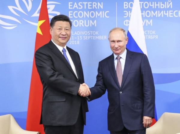 China's President Xi Jinping holds talks with Russia's President Vladimir Putin in Vladivostok on September 11, 2018. [Photo: Xinhua/Xie Huanchi]